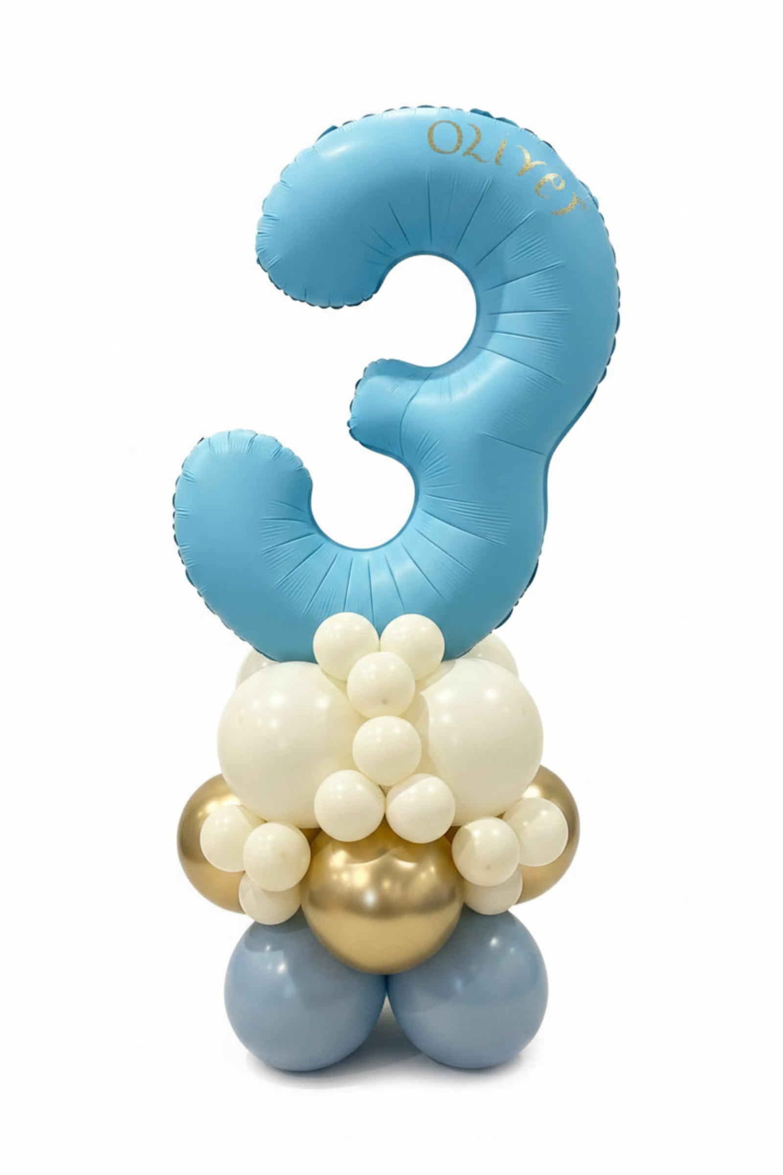 A custom balloon decoration featuring a large light blue number '3' balloon with the name 'OLIVY' printed in gold, supported by a cluster of white, light blue, and metallic gold balloons on a white background.