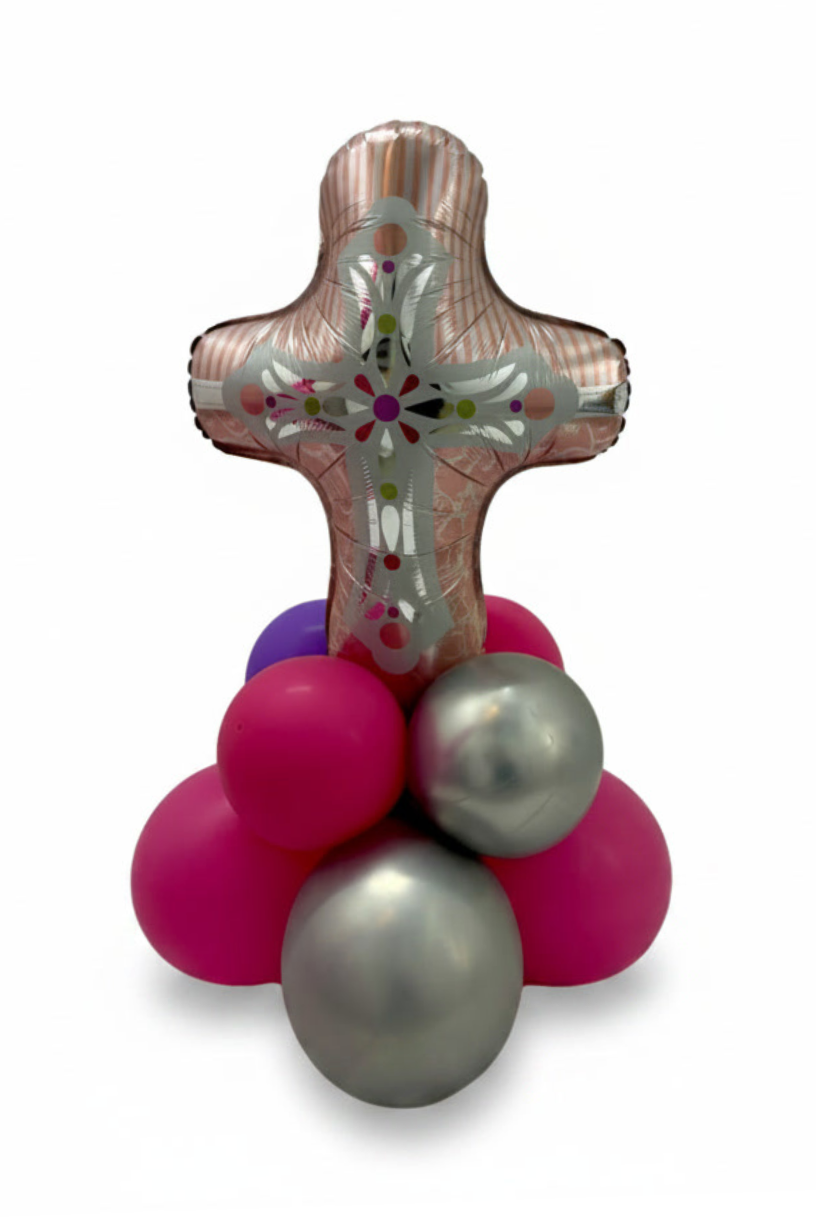 Decorative cross made of balloons with pink, purple, and silver balloons on a white background