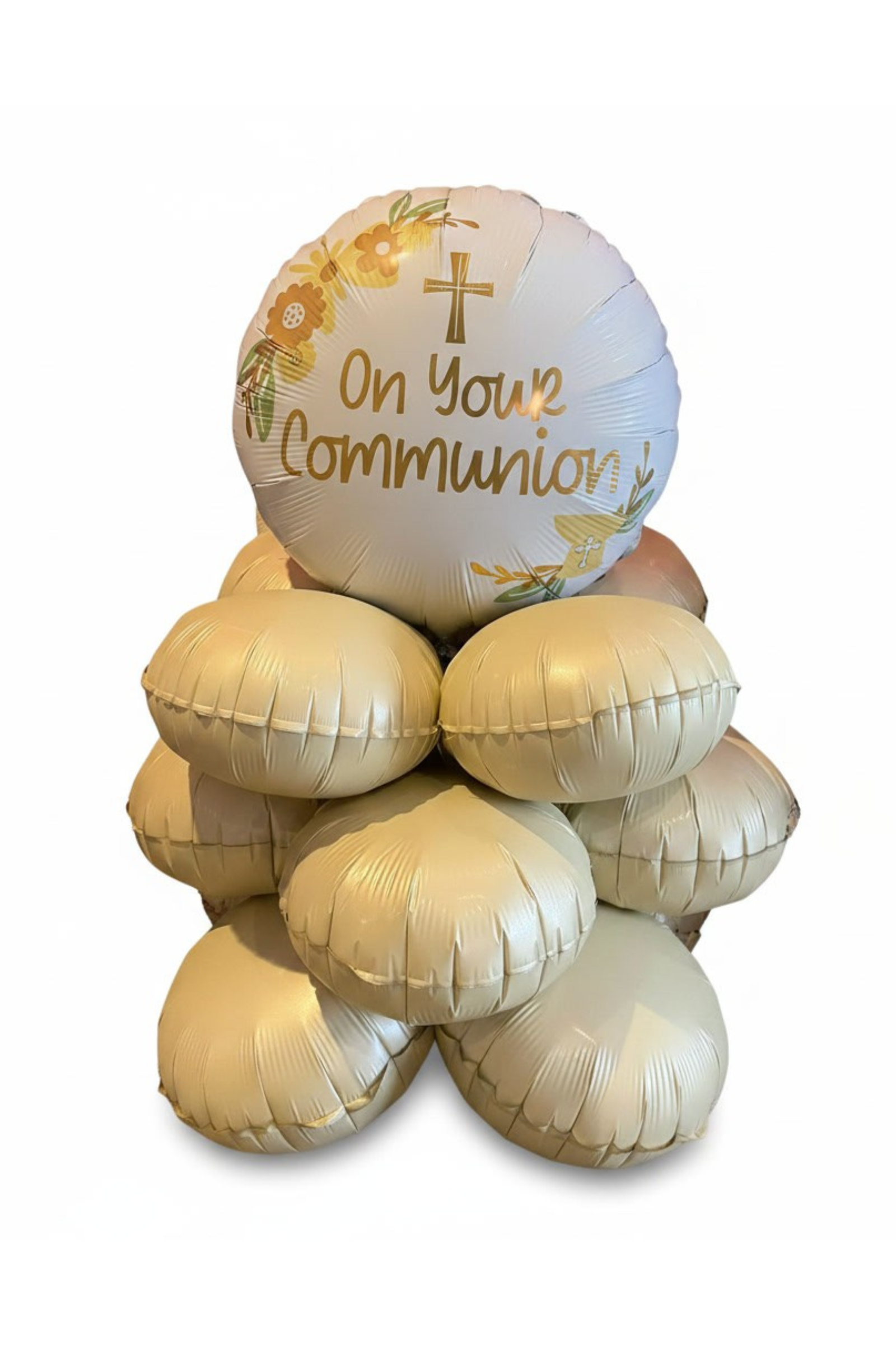 Decorative balloon arrangement with 'On Your Communion' text on a white background