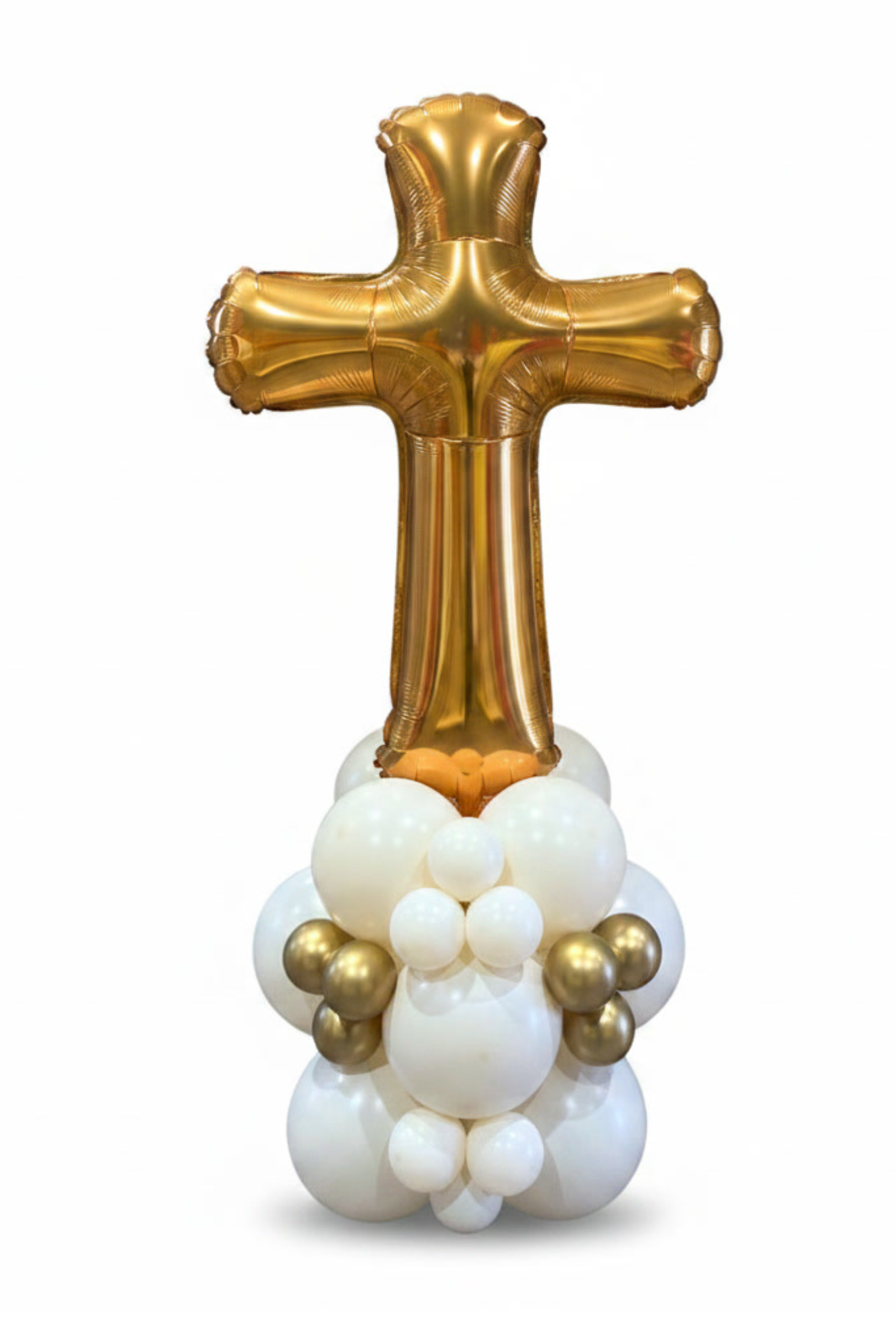 Gold and white balloon sculpture shaped like a cross on a white background