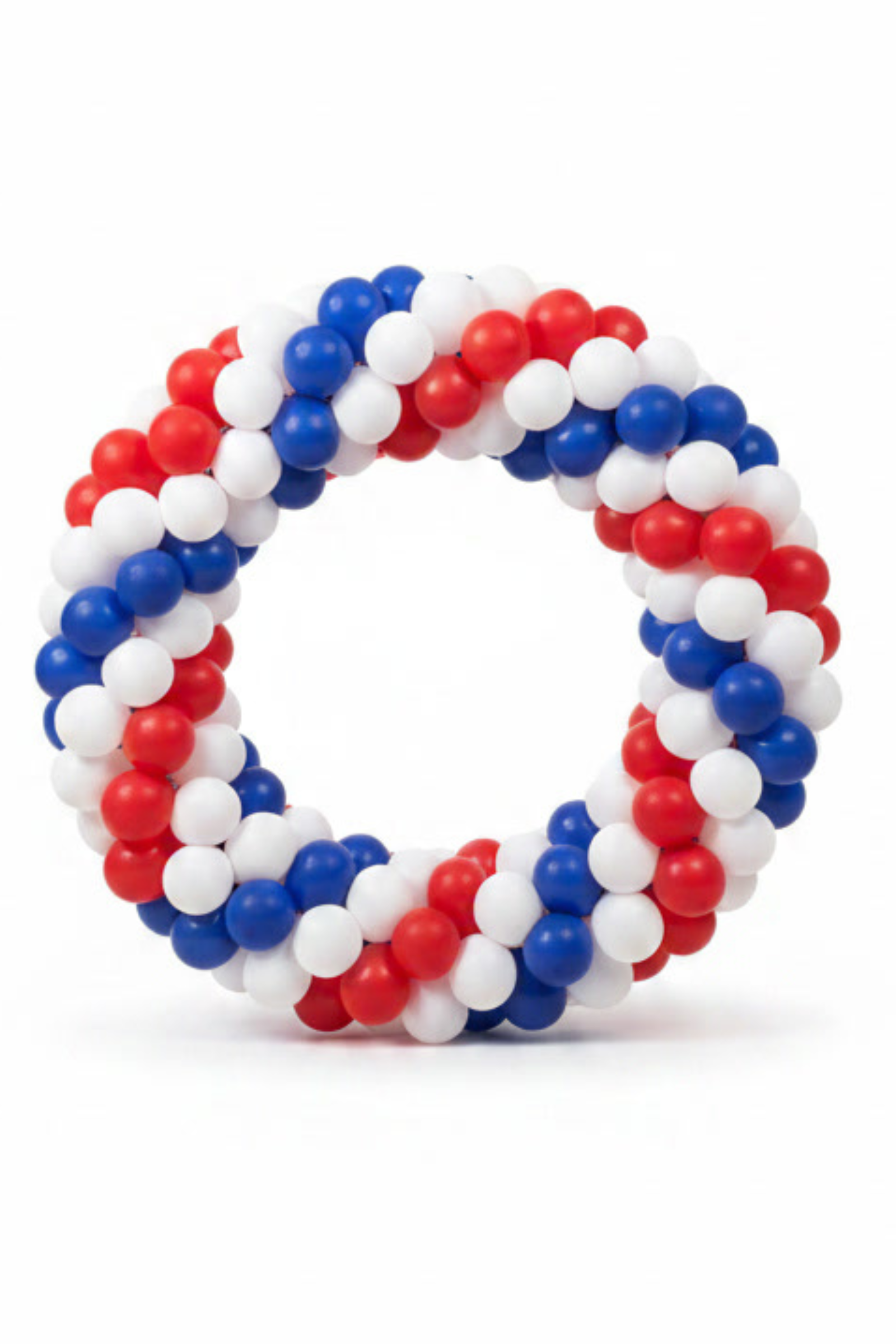 A circular balloon wreath made of red, white, and blue balloons, photographed against a plain white background.