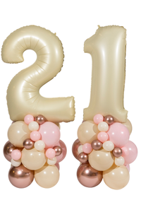 Decorative balloons shaped like the number '21' with pink and gold balloons below on a white background.